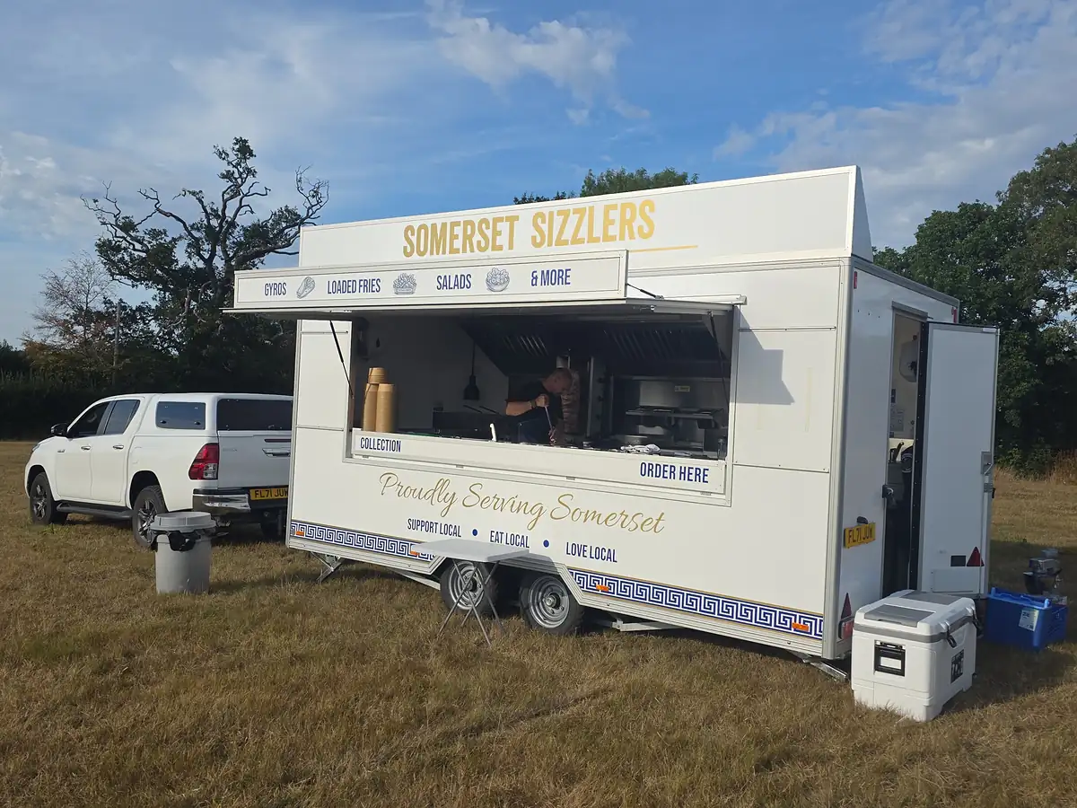 Cooking to order inside the trailer at an outdoor event