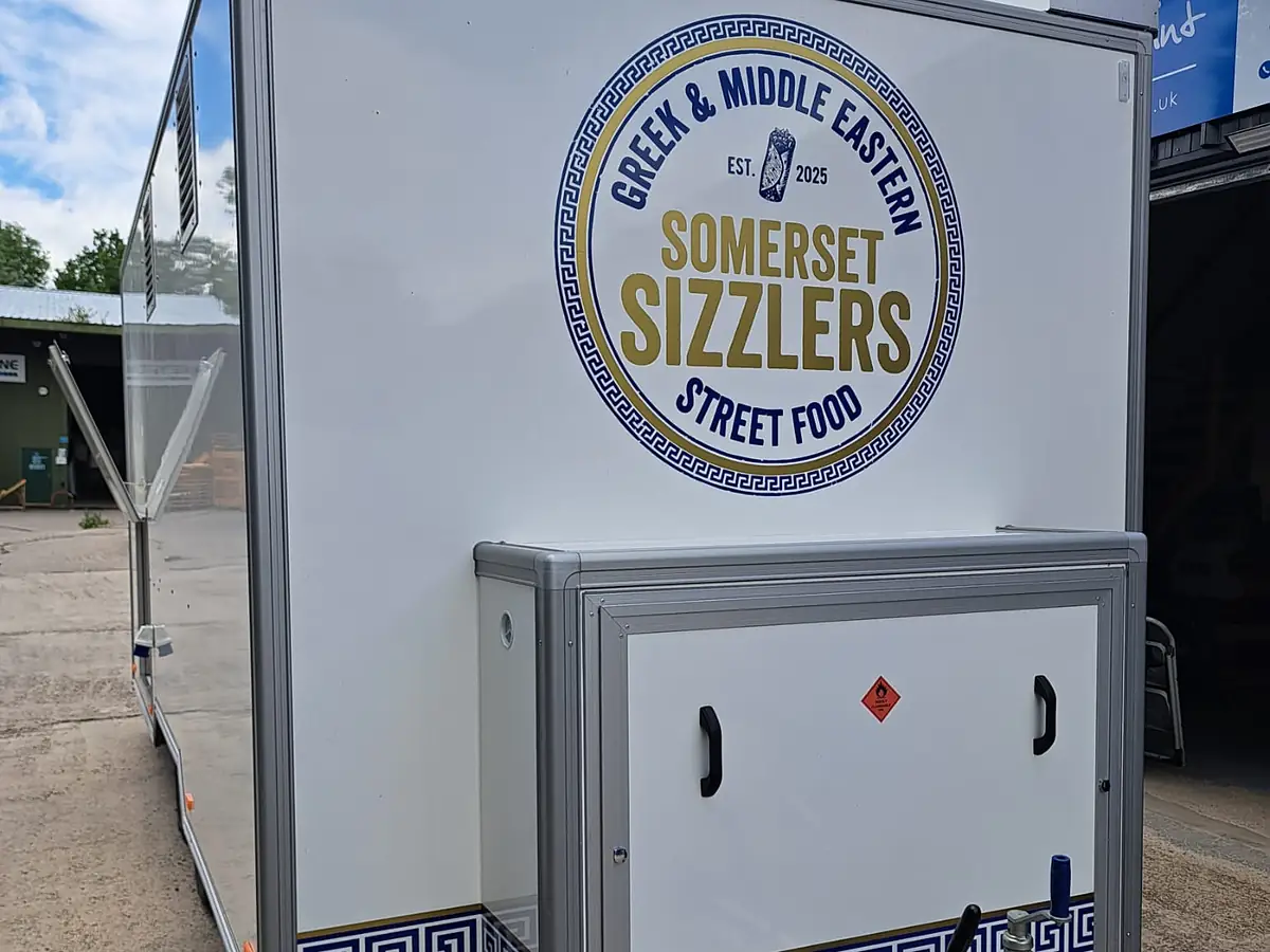 The Somerset Sizzlers logo badge on the front of the trailer