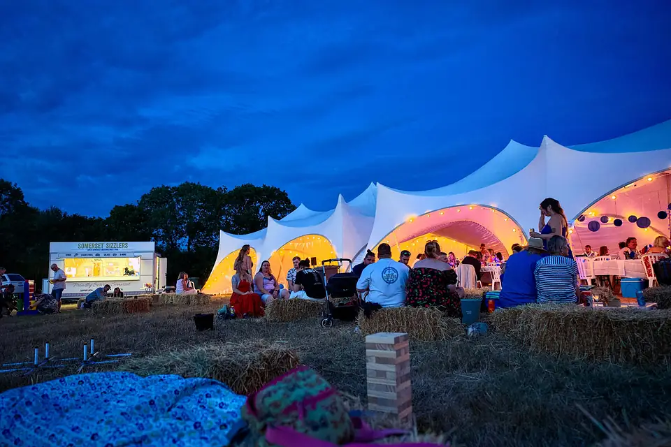 The Somerset Sizzlers trailer set up beside a white stretch marquee at a private celebration